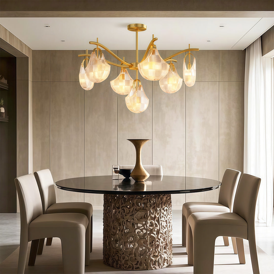 Shell chandelier above a contemporary fluted dining table