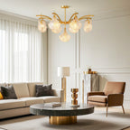 Shell chandelier in an elegant neutral living room with gold accents