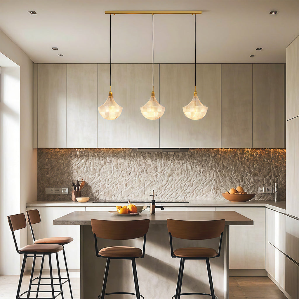 Shell chandelier in a modern kitchen with leather chairs