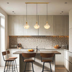 Shell chandelier in a modern kitchen with leather chairs