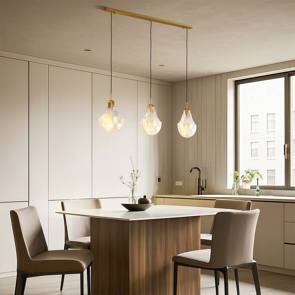 Shell chandelier over a dining table with upholstered chairs