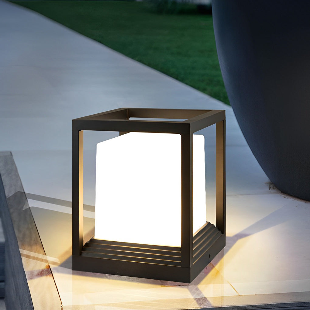 Sleek pedestal lights on a patio beside a water feature