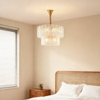 Small chandelier hanging in a bright minimalist bedroom
