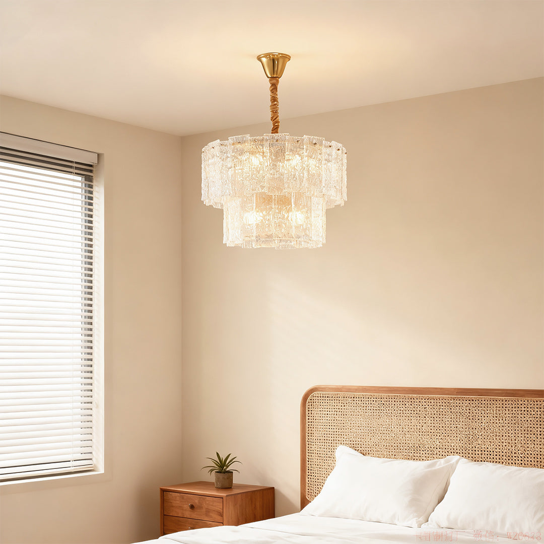 Small chandelier hanging in a bright minimalist bedroom