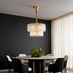 Small chandelier in a contemporary dining room with dark wall