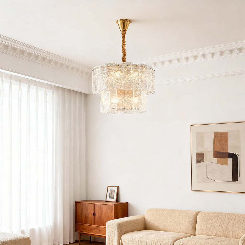 Small chandelier in a serene beige bedroom with sheer curtains