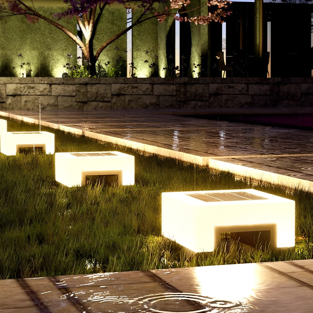 Solar post lights along a modern garden walkway