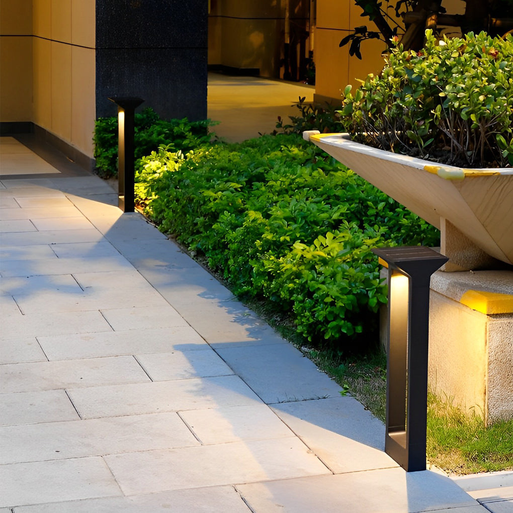 Solar pathway lights in a landscaped garden bed