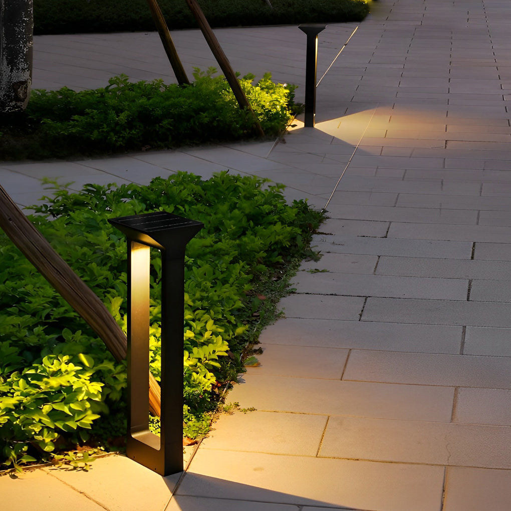 Solar pathway lights lining a stone walkway outdoors