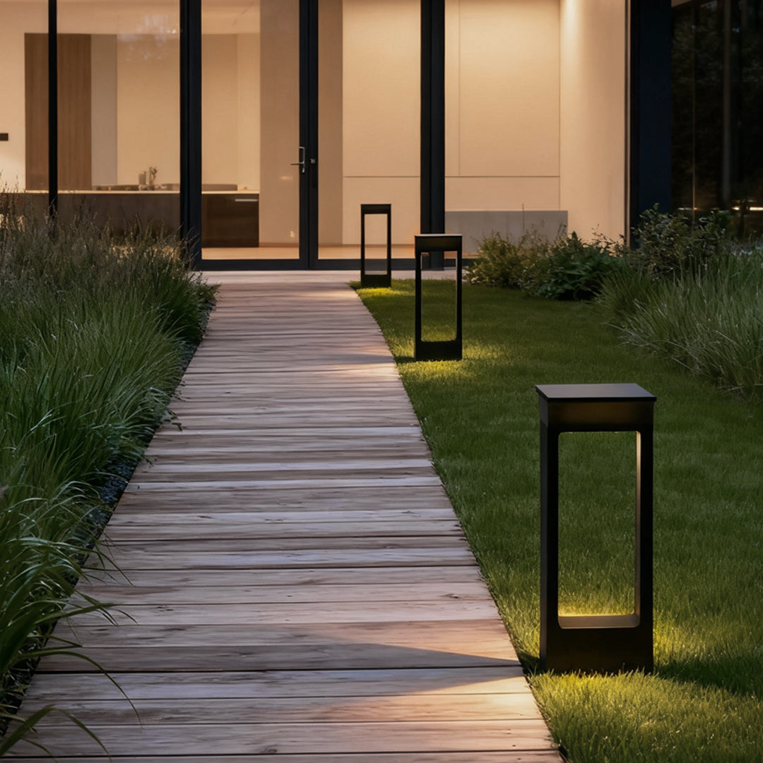 Solar pathway lights along a wooden walkway at night
