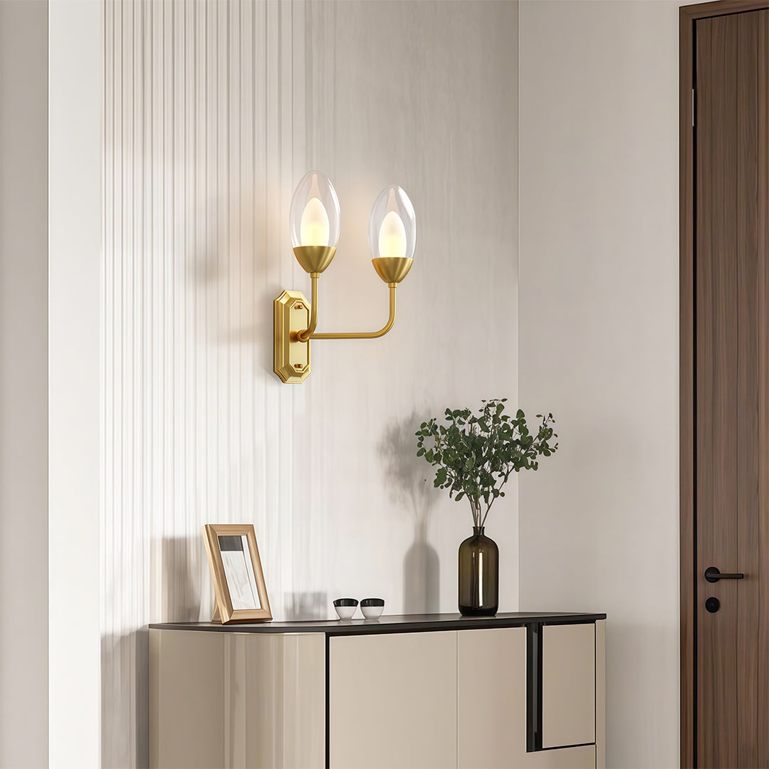 Glass wall light giving warm ambient light in an entryway