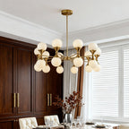 Sophisticated gold bubble chandelier above dark wood