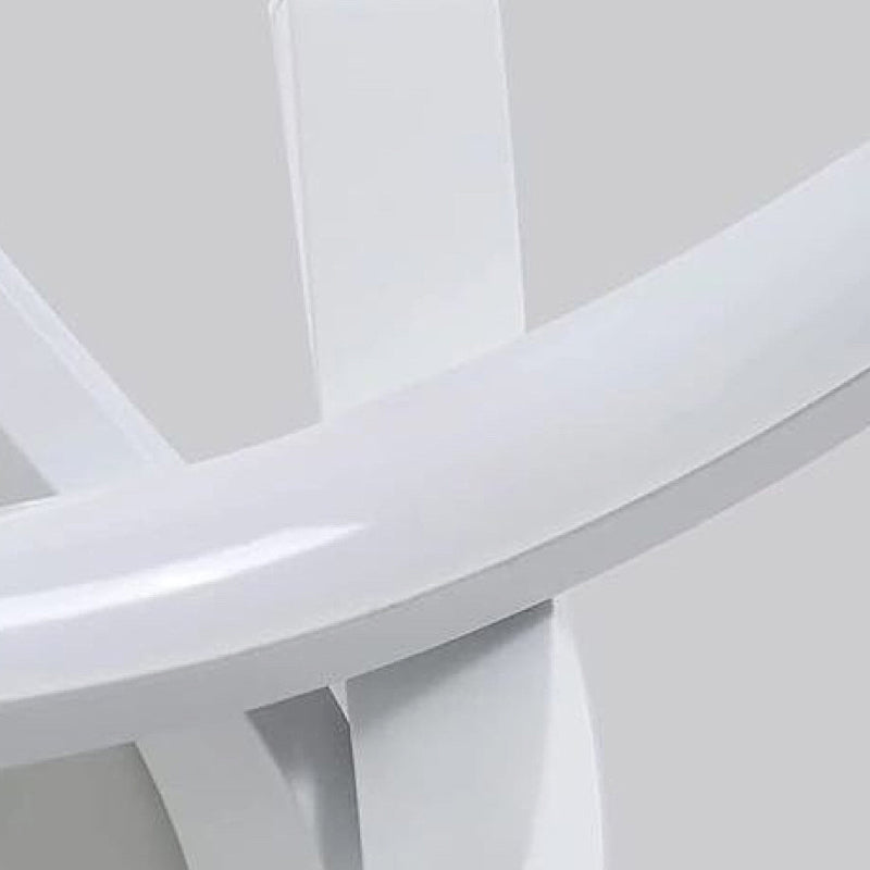 Spiral sconce on a white wall showing its modern design