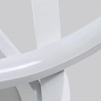 Spiral sconce on a white wall showing its modern design