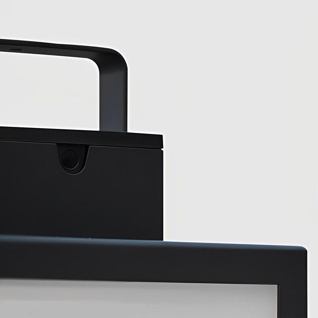 Black framed square lantern placed on an outdoor table