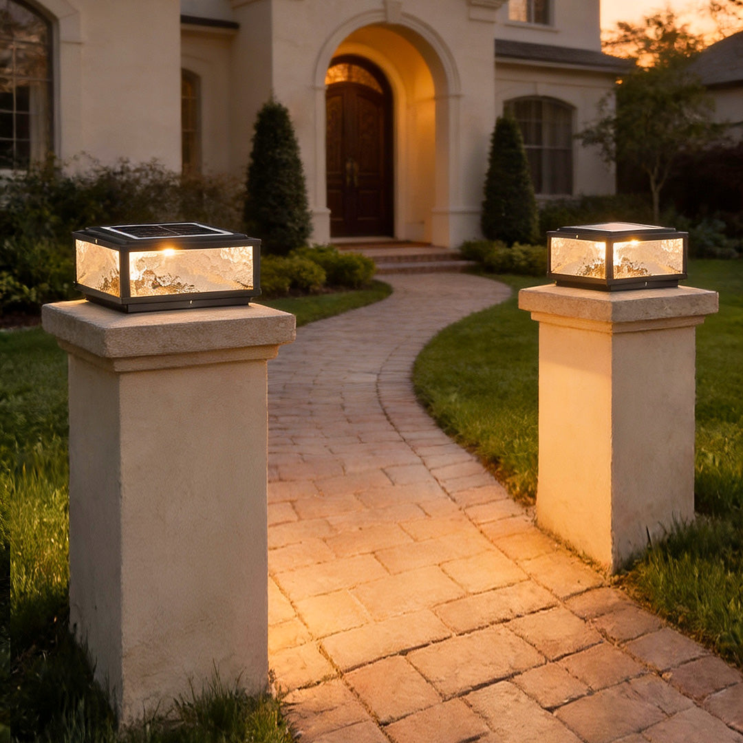 Square pillar lights at a garden pathway entrance