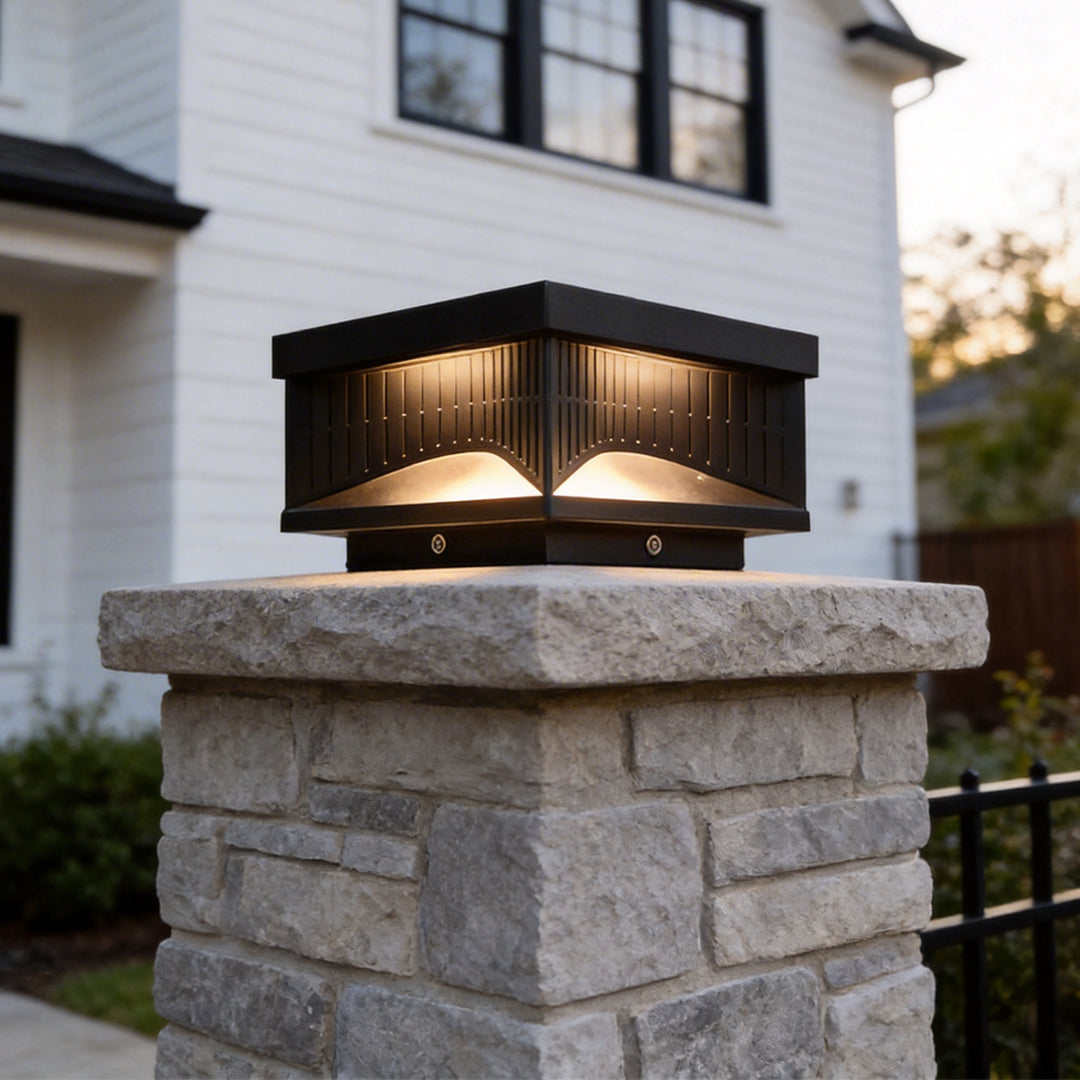 Striped square pillar light lighting a garden driveway and patio