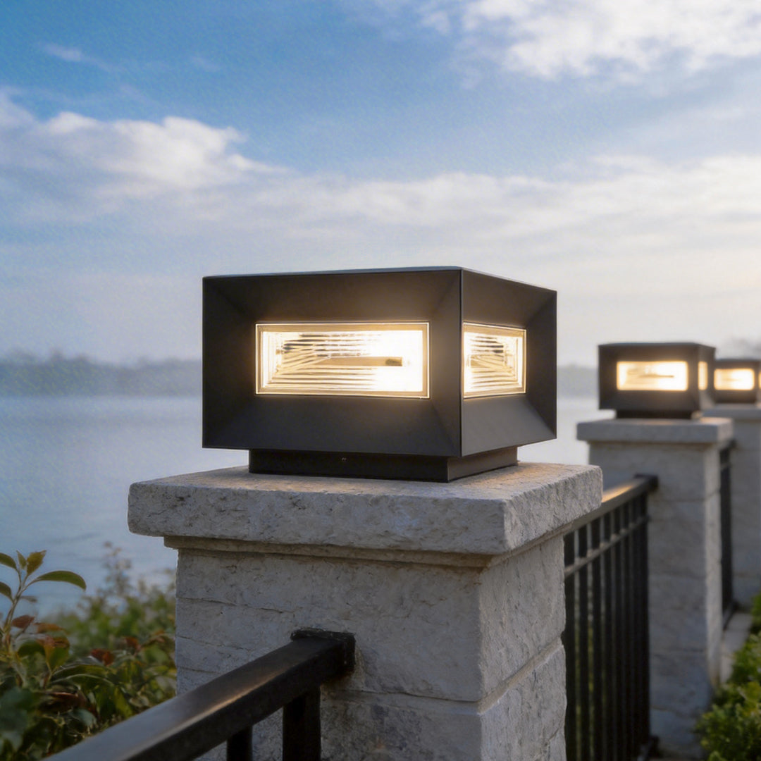 Cube pillar light lighting a garden driveway and patio
