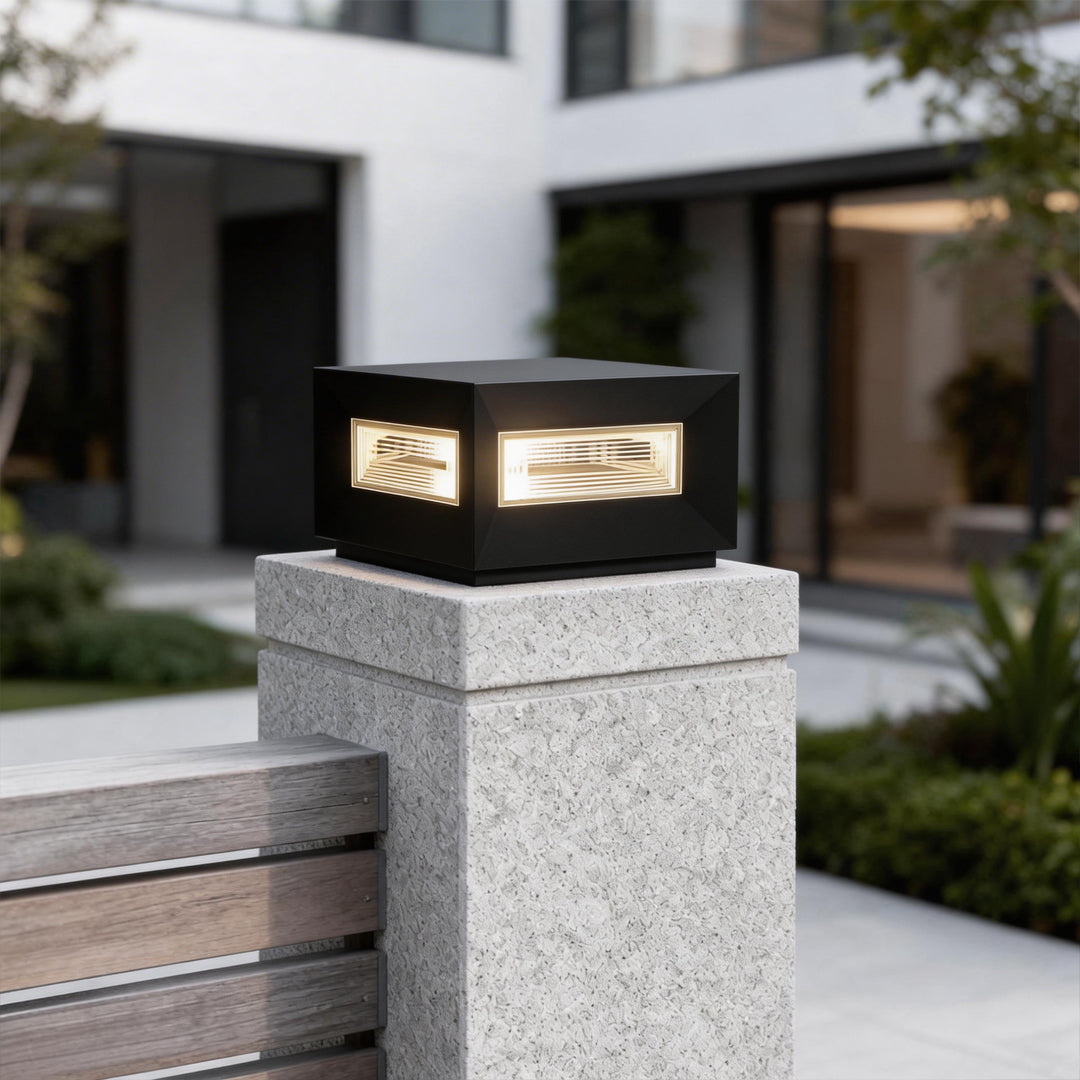 Waterproof cube pillar light shown in an exterior landscape