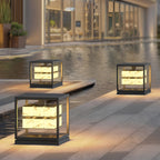 Square solar pillar light standing in a modern yard