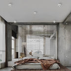 Square white grid spotlight mounted on a plain ceiling