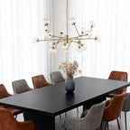 Bubble sputnik chandelier as a focal point in a white dining room