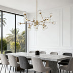 Gold bubble sputnik chandelier below a vaulted ceiling