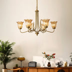 Gold glass chandelier glowing with warm illumination