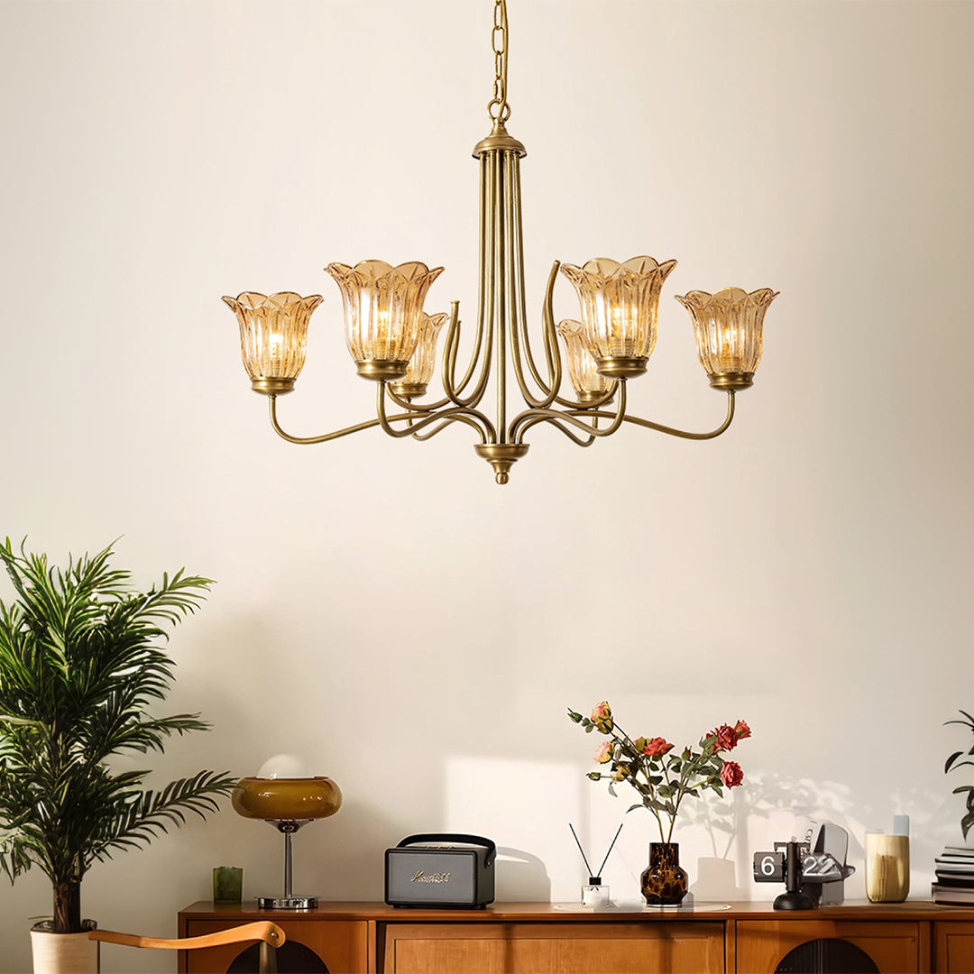 Gold glass chandelier glowing with warm illumination