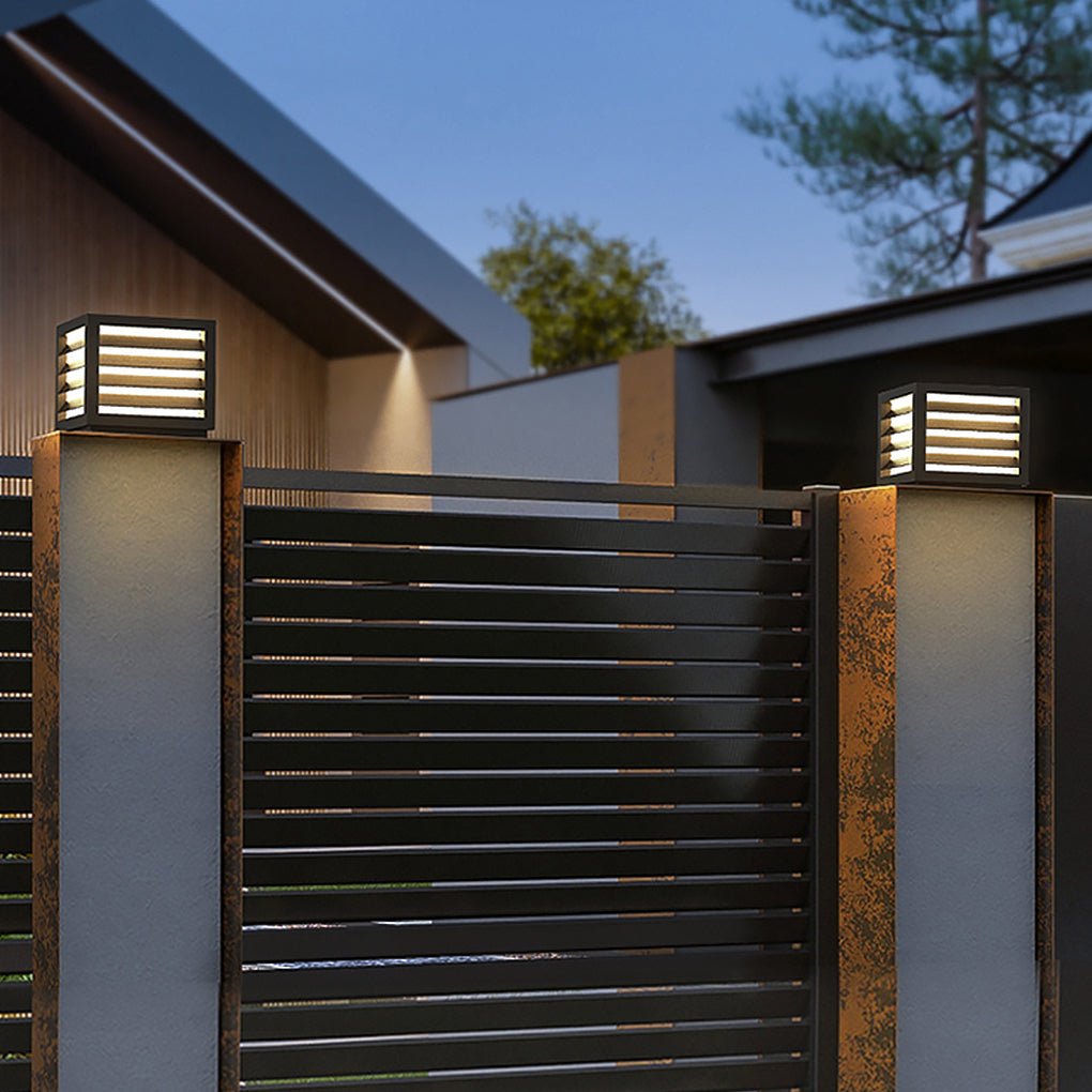 Stylish LED pillar light illuminating a front yard