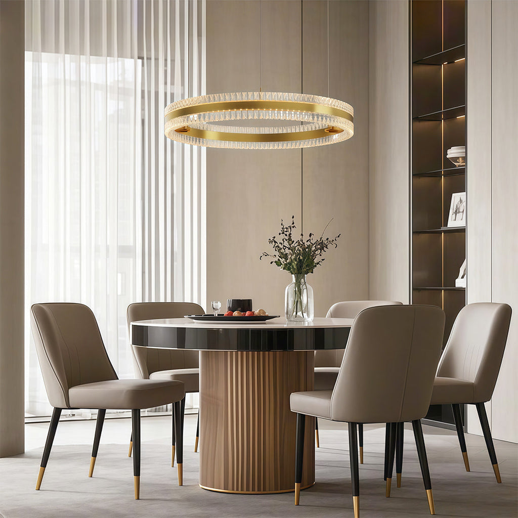 Gold finish circular chandelier in a modern interior