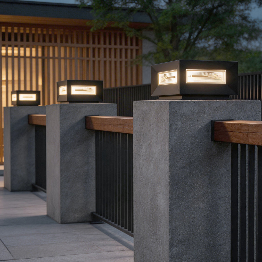 Cube pillar light giving light in a front yard