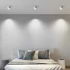 Surface spotlight lighting a sleek contemporary living room
