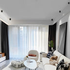 Square grid spotlight giving ambient light in a contemporary living room