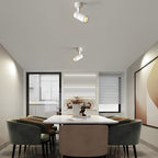 Surface spot lights mounted in a dining room ceiling