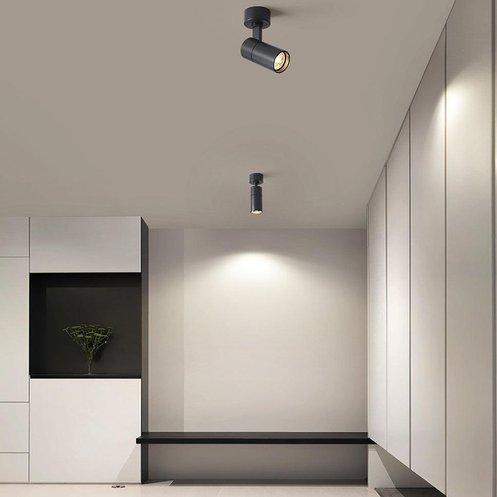 Surface spot light in a minimalist corridor ceiling