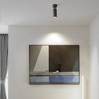 Surface spot light aimed at modern wall art