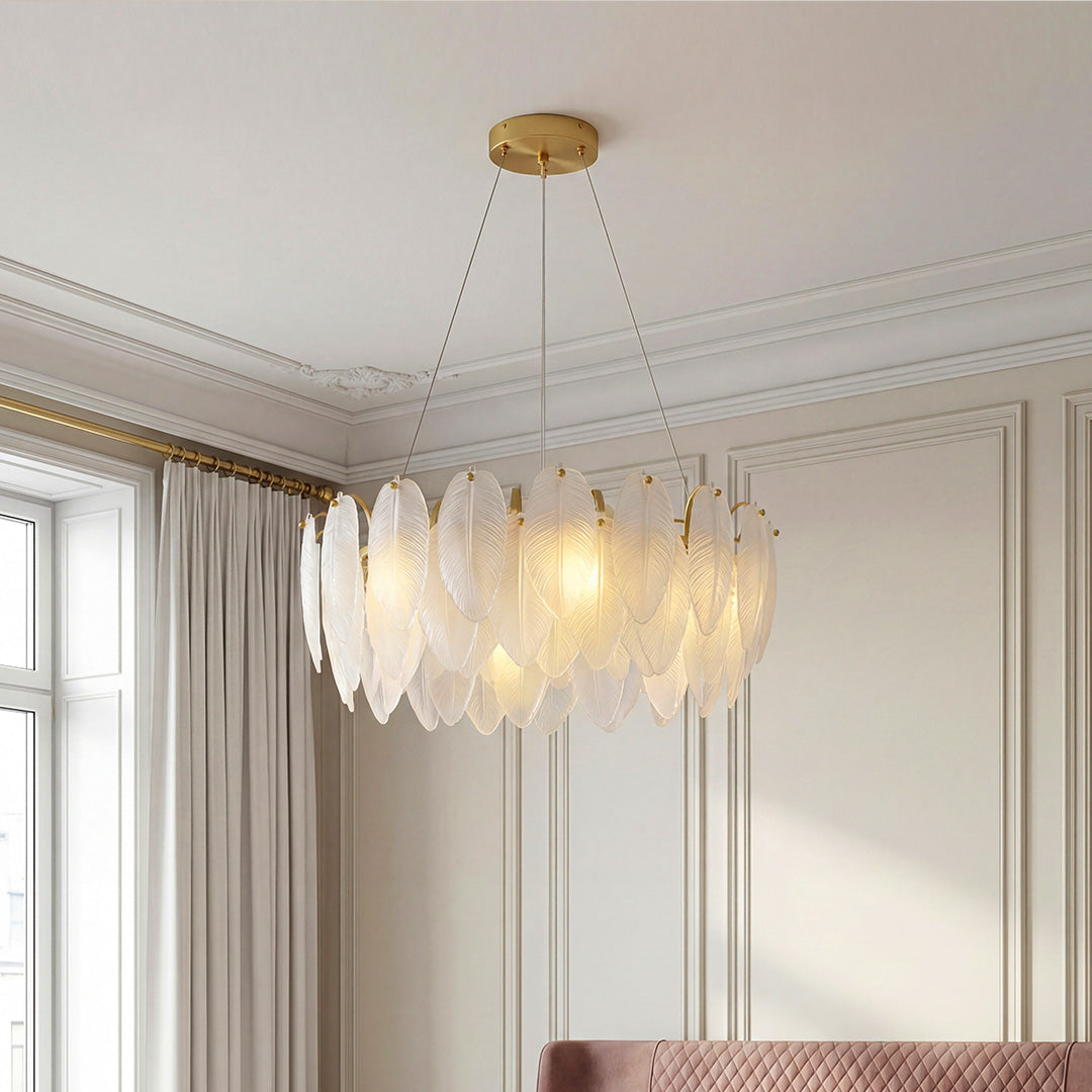 Tiered gold feather chandelier with frosted glass shades