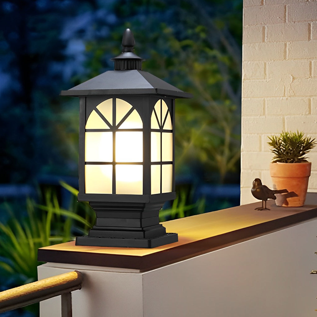 Traditional post lantern mounted on a garden fence wall