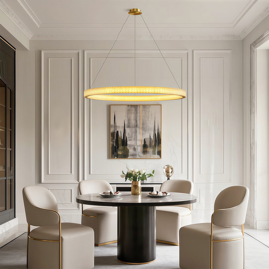 Crystal chandelier above a table with a sculptural base