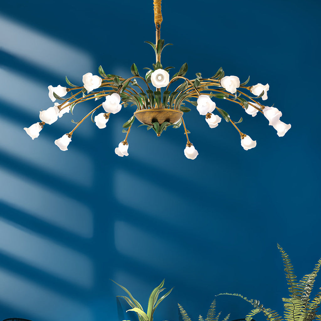 Floral chandelier with colourful blooms in a teal bedroom