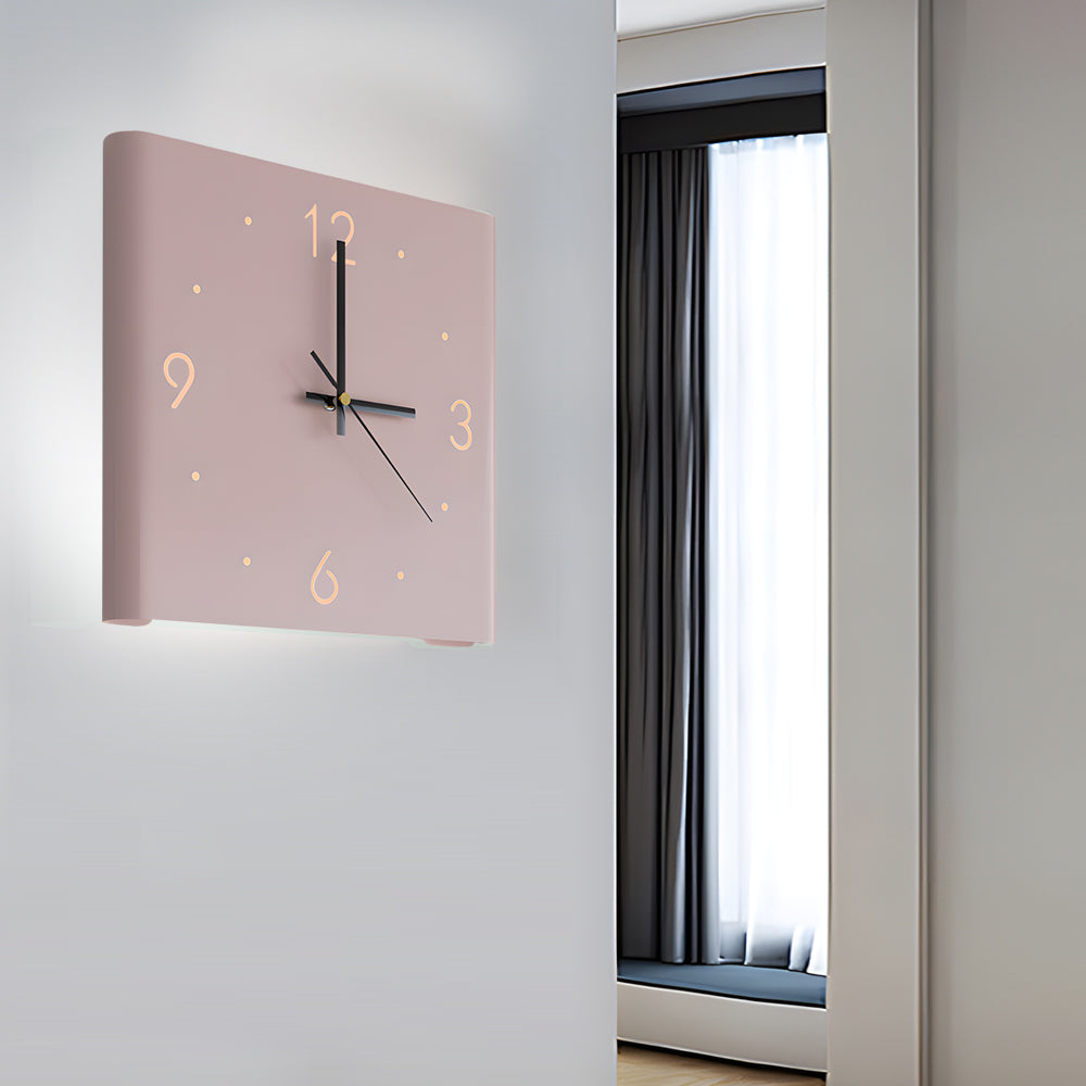 Wall clock lamp mounted on a bedroom wall