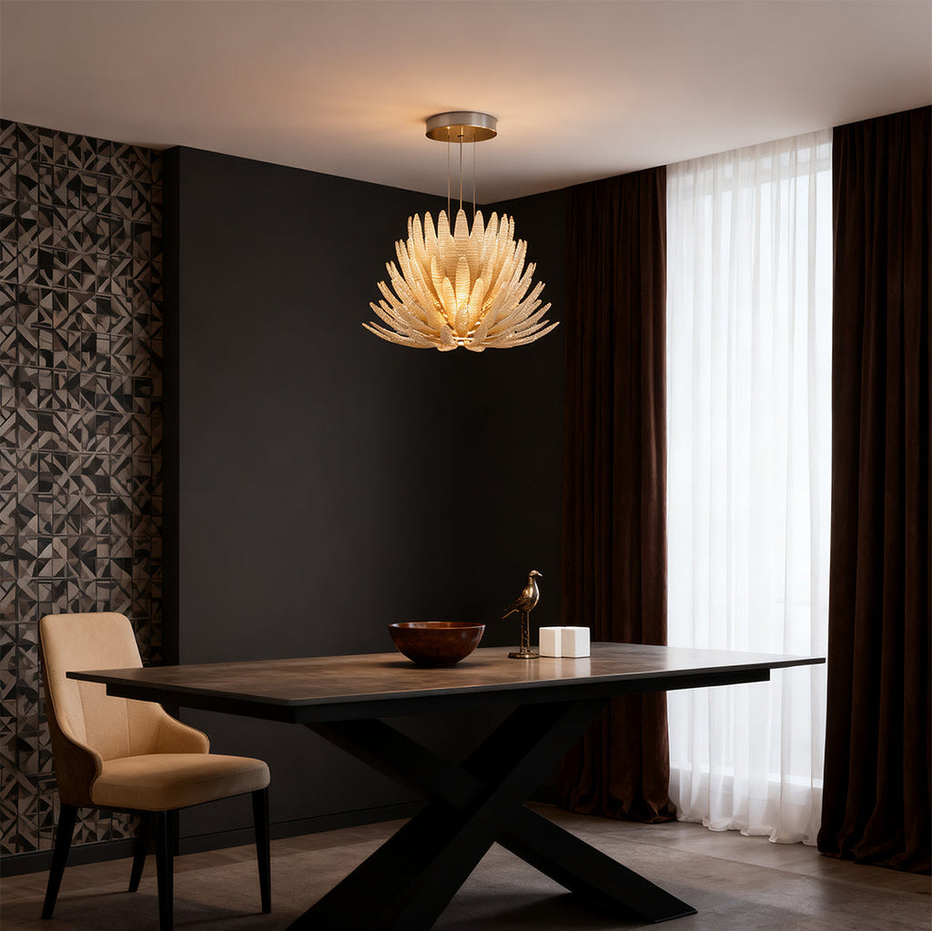 Warm glass deco chandelier hanging above a dining table
