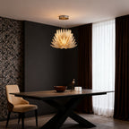 Warm glass deco chandelier hanging above a dining table