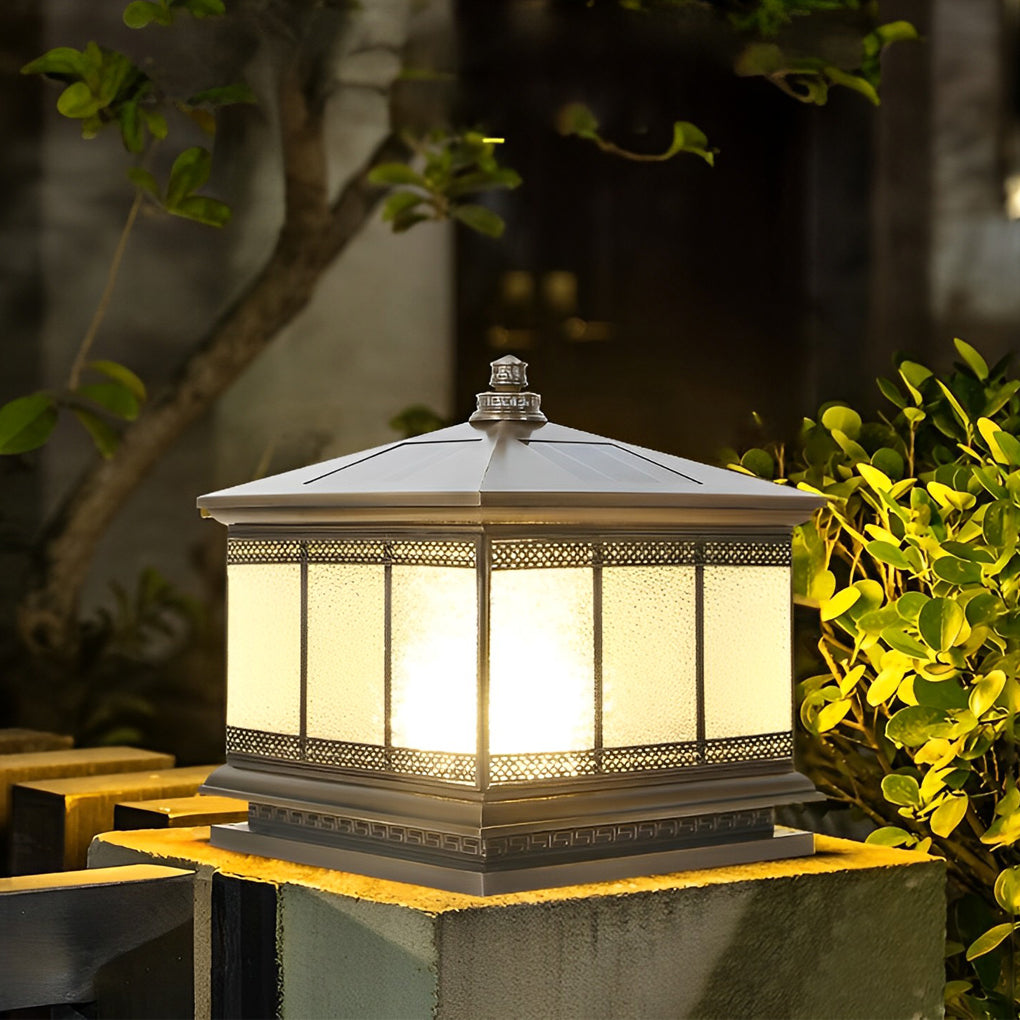 Gate pillar light mounted on a low wall