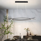 Curved wave pendant light in a minimalist interior space