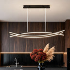 Wave pendant light above a modern dining room table
