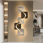 Wave pattern sconce giving soft light in a modern bedroom