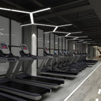 Y-shaped linear lights fitted to a gym ceiling